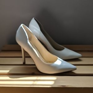 Enzo white pumps